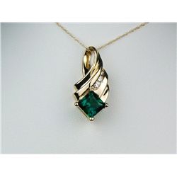 Fabulous 10K YG Ladies Design PendantSet with a fine green created Emerald  weighing approx 1.50 car