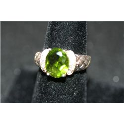 Sterling Silver Ring W/Oval Shaped Green Gemstone Surrounded By White Gemstones