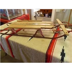 Vintage 1950's Sears snow sled wood slates, metal frame, and measures 45 x  14 x 6 inches