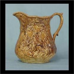 Bennington type pitcher with hunter, circa 1840. Slight crowsfoot  in bottom doesn't go through. Not