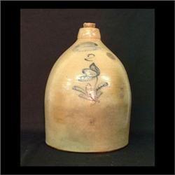 J. Burger Jr. two-gallon stoneware jug. Rochester, New York.  Decorated with a single blue flower. T