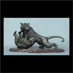 Bronze tiger and bear. Oriental bronze depicting a tiger and bear  fighting. Signed with Oriental ch