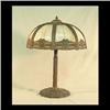 Image 1 : Slag glass lamp attributed to Miller. Eight caramel colored bent  glass panels held by decorative pi