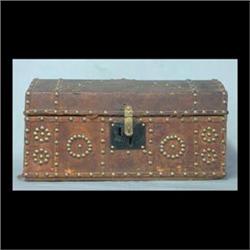 Leather storage trunk with decorative brass buttons and leather  strips. Inside is lined with 1830 A
