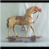 Image 1 : Wooden horse pull toy. Horse is mounted on a platform with iron  wheels. Original leather strappings