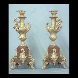 Spelter and marble candelabras with seated cherubs. Note back  feet replaced and candelabras have be
