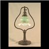 Image 1 : Handel harp desk lamp base with green pulled feather shade. Shade  is unsigned. Note chips to shade