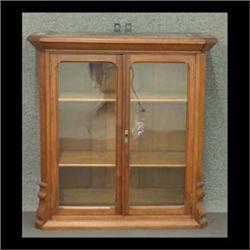 Victorian two-door hanging cabinet. Walnut with inset burl side  panels. There are two dowel holes i