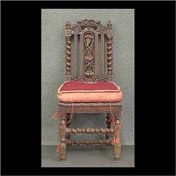 Carved oak side chair decorated with pierce-carved grapes and  rope-turned stretcher. 49'h x 20"w x