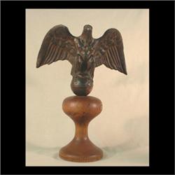 Full body copper eagle. Eagle is perched on a round sphere with out  stretched wings. Original dark
