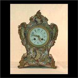 French clock with bronze and enamel decoration overall. Porcelain  face signed C. A. Selzer. Brass w