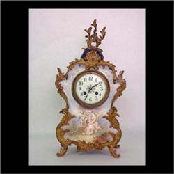 French blue porcelain clock hand painted with bronze mounts. Font  is a scene depicting an angel and