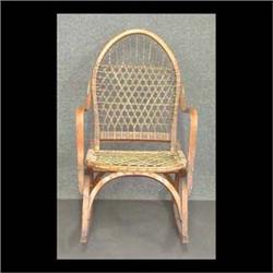 W.F. Tubbs Co. "Sno Shu" child's size rocker. Ash with woven gut  seat and bent wood arms. Original