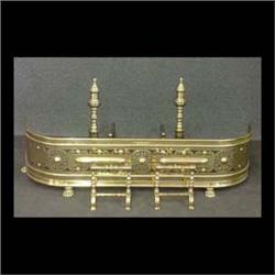 Five piece group of brass fireplace items. Pair of andirons 19  1/2"h x 19"d. Fender 11"h x 45"w x 1