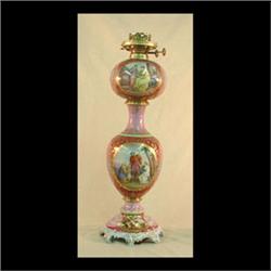 Royal Vienna kerosene lamp. Decorated with griffins and gold swags.  Beehive mark. Electrified. 23"
