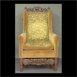 Carved and upholstered arm chair, pierce-carved crest with two  children dancing around an urn. Gold