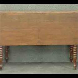 Victorian walnut drop leaf table with spool turned legs. 28 3/4"h x 50 1/4"w x 41"d $250-350
