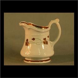 Ironstone pitcher with lustre decoration of flowers. E. Walley. 5 1/2" $80-120