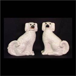 Pair of Staffordshire dogs with glass eyes. Two hairlines to back  of one. 12 1/2" h $200-300