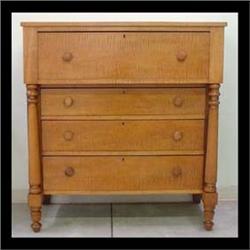 Tiger maple chest of drawers with one large over-hanging drawer  above three graduated drawers, flan