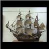 Image 1 : Model of an early British battleship. Ship has seventy-four  cannons, twelve sails, and a carved hea