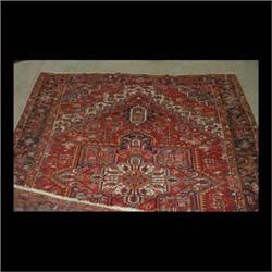 Heriz Oriental rug. Mid 20th century design in varying shades of  blues, reds, mustard, and white. 1
