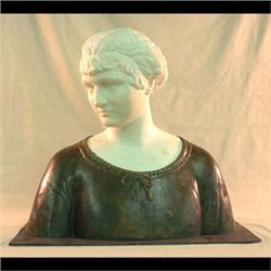 Bronze and marble bust of a woman. Woman's head and neck are white  marble with shoulders in bronze.
