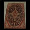 Image 1 : Oriental rug. Central diamond shaped medallion in reds, beige, and  green on a gray and black field.