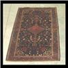 Image 1 : Sarouk Oriental rug. Pink diamond shaped central medallion on a  dark blue ground, with stylized flo