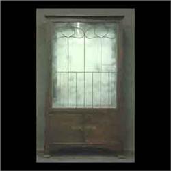 Mission oak china cabinet with a single leaded glass door and  leaded glass sides. Original finish w
