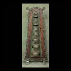 Set of nine graduated Oriental bells supported in ornately carved  frame with flower and leaf motif.