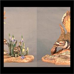 Boehm bird figure. Pair of killdeers and babies.Male with  bluebells. #473g, signed. Note one male w
