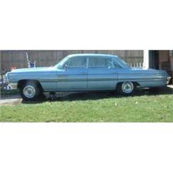 1962 Oldsmobile Ninety Eight Holiday Hard Top. Four door, baby  blue, 394 rocket motor. Body and int