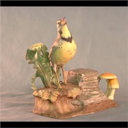 Boehm bird figure. Meadowlark. Stamped #435. Note minor damage to   petals of dandelion. 8 1/2" tall