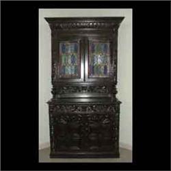 Oak court cupboard. Heavily carved with fruit, nuts, scrolls, lion  heads, and other embellishments.