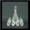 Image 1 : Clear glass liquor set attributed to Steuben. A tear drop form  decanter, with a single elongated bu