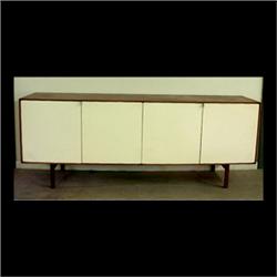 Florence Knoll credenza. Four white lacquered doors with chrome  plated pulls, walnut veneer case, a