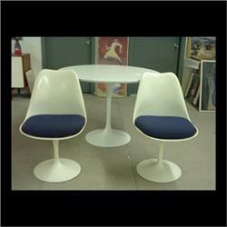 Eero Saarinen dinette set. Pedestal table and four chairs. Aluminum  chair bases have beenstripped a