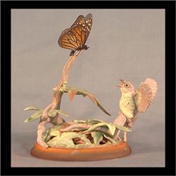 Boehm bird figure. Fledgling Canada warbler with Monarch butterfly.  #491, signed. 8 1/4" h $900-120