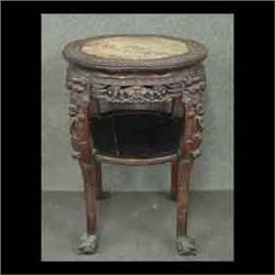 Carved Oriental plant stand, with a scalloped top and marble inset. 31"h x 21"d $200-250