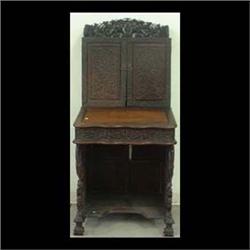 Teakwood lady's writing desk. Pierce-carved upper gallery above  two carved doors. Interior contains