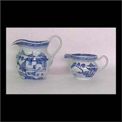 Two Canton milk pitchers. Circa 1900. Both have pagodas, mountains,  trees, boats, bridge, and cloud