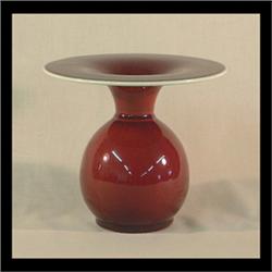 Catalina Island oxblood pottery vase with wide flaring lip. 5 1/2" h X 6 1/2" d $300-400