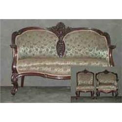 Three piece carved Victorian parlor set. Deep mid-relief carvings  in center of each back with scrol