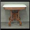 Image 1 : Victorian marble-topped table. White marble with an ornate  transitional Renaissance base. 30" h X 3