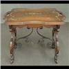 Image 1 : Carved walnut tea table. Scalloped top has a hand-painted floral  and scroll design. Cut-out legs en