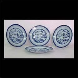 Seven Canton dinner plates. Circa 1840. Clouds around edge,  pagodas, trees, boat, and a bridge. Min