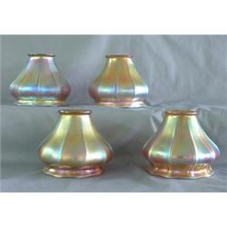 Set of four Steuben gold Aurene shades, not signed. 1/4" chip to  one on fitter and another with two
