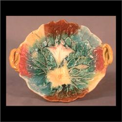 Majolica footed bowl with stylized morning glories and leaf motif,  handles are twisted twigs. Note