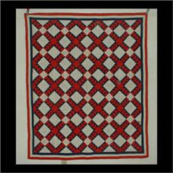 Red, white, and blue Friendship quilt in a variation of birds in  flight. Names written inside white